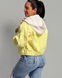 Oversized yellowish denim jacket with hood